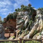 fantasy springs standby passes, rock formation with a waterfall and a fence