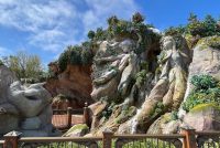 fantasy springs standby passes, rock formation with a waterfall and a fence